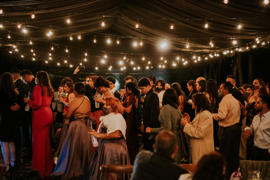Elegant corporate reception with guests in warm lighting